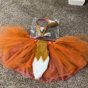 Fox skirt (tail attached Velcro) and fox ears.